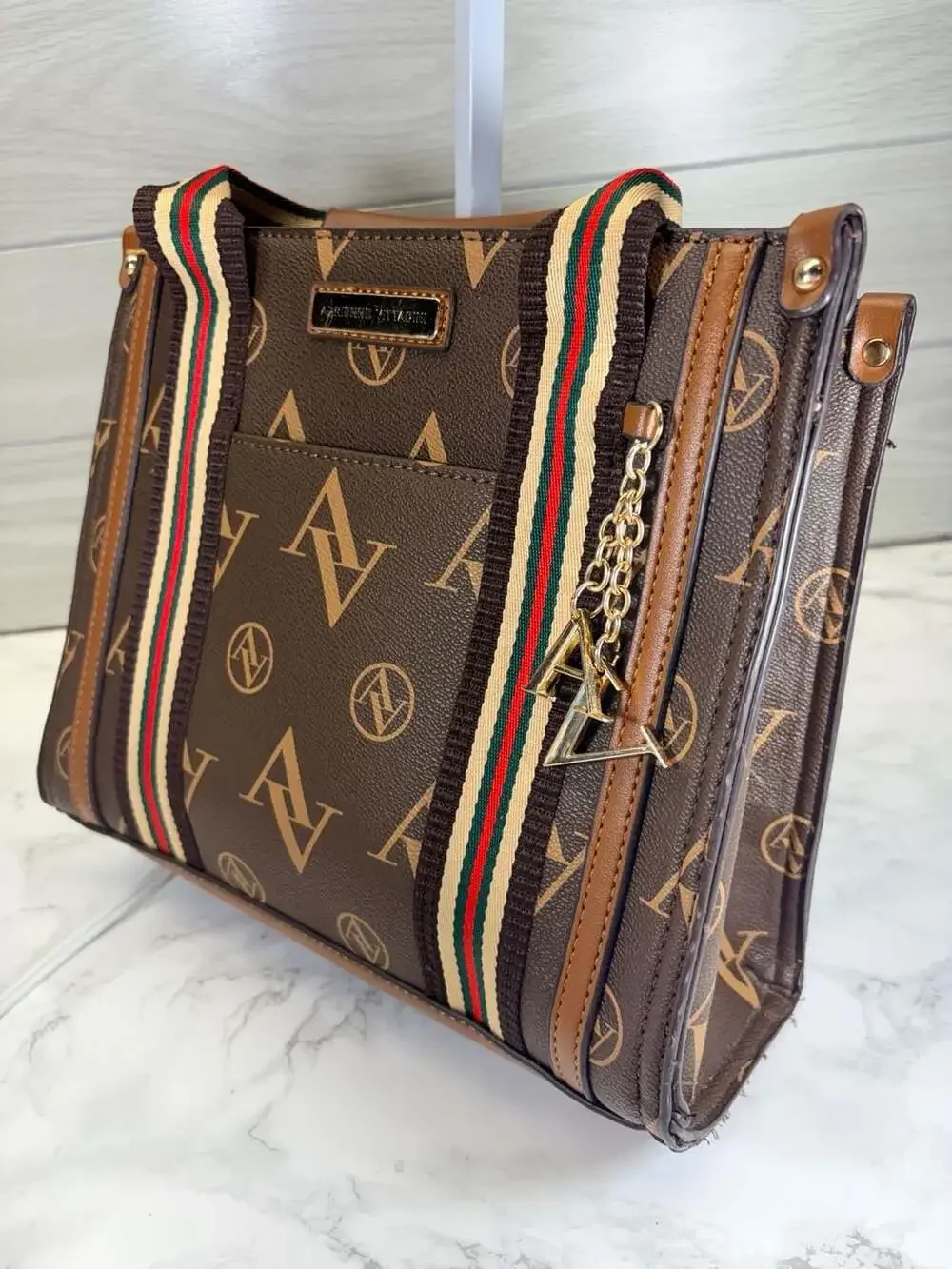 Adrienne Vittadini brown satchel handbag featuring an 